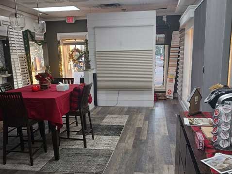 Store interior showcasing several different types of window coverings